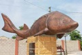 Памятник  "Его величеству Царь - рыбе осетру  в селе Белосарайская коса